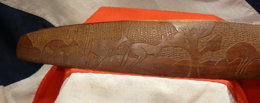A Vintage Carved Aboriginal Culture Wunda Parrying Shield With a Chip Carving Design of Kangaroo and Emu.