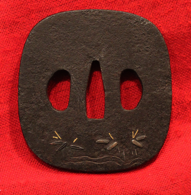 An Iron Plate Katana Edo Tsuba Decorated With Small Figures In Rain Garb