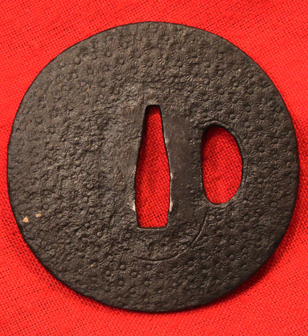 An Edo Period Armourer's Myochin School Chrysanthemum Katana Tsuba