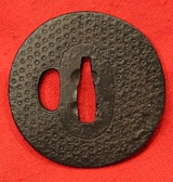 An Edo Period Armourer's Myochin School Chrysanthemum Katana Tsuba