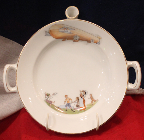 A Very Good German 1900's & WW1 Porcelain Zeppelin Plate Warmer