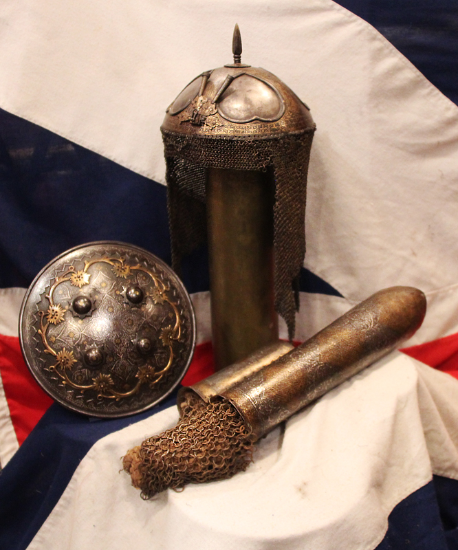 A Gold Inlaid Traditional Persian Armour Suite, of Helmet, Shield & Arm Defence. The Kulah Khud,(کلاهخود) Sipar (سپر), and Bazu Band (بازوبند). Late 18th to Early 19th Century, Possibly Wootz Steel { Pulad}