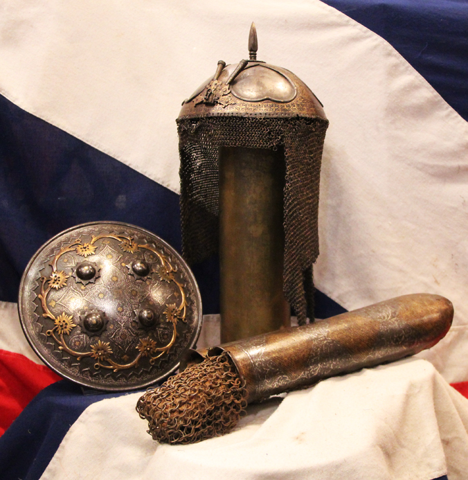 A Gold Inlaid Traditional Persian Armour Suite, of Helmet, Shield & Arm Defence. The Kulah Khud,(کلاهخود) Sipar (سپر), and Bazu Band (بازوبند). Late 18th to Early 19th Century, Possibly Wootz Steel { Pulad}