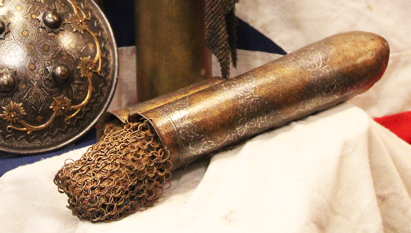 A Gold Inlaid Traditional Persian Armour Suite, of Helmet, Shield & Arm Defence. The Kulah Khud,(کلاهخود) Sipar (سپر), and Bazu Band (بازوبند). Late 18th to Early 19th Century, Possibly Wootz Steel { Pulad}