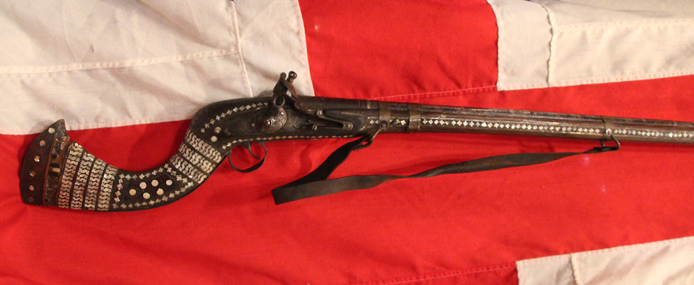 An 18th Century Highly Decorated North West Frontier Jazail, With The Iconic Recurved Butt Stock & Elaborate Inlaid Decor