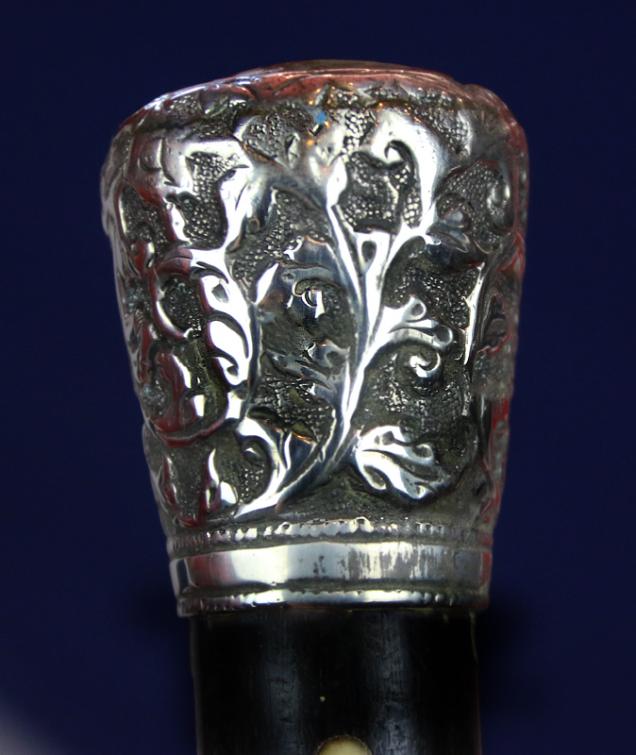 A Most Interesting & Beautiful Quality Victorian Walking Cane. With a Florid Repousse Silver Top, Carved Spiral Haft With Carved Bullet Inlays