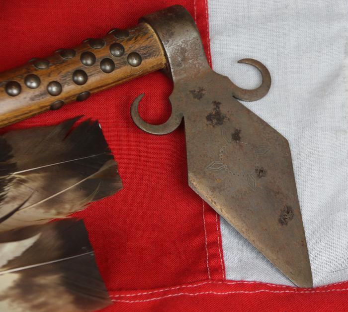 A Superbly Attractive, Native American Indian 'Spontoon Head' Style Tomahawk with Studded Haft, Glass Beads, and Eagle Feathers.