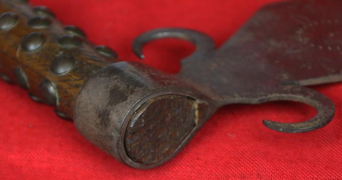 A Superbly Attractive, Native American Indian 'Spontoon Head' Style Tomahawk with Studded Haft, Glass Beads, and Eagle Feathers.