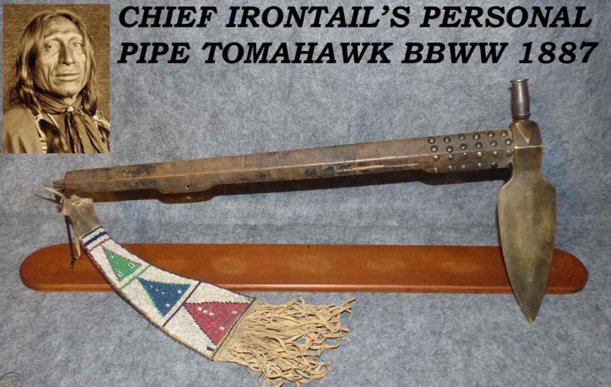 A Superbly Attractive, Native American Indian 'Spontoon Head' Style Tomahawk with Studded Haft, Glass Beads, and Eagle Feathers.