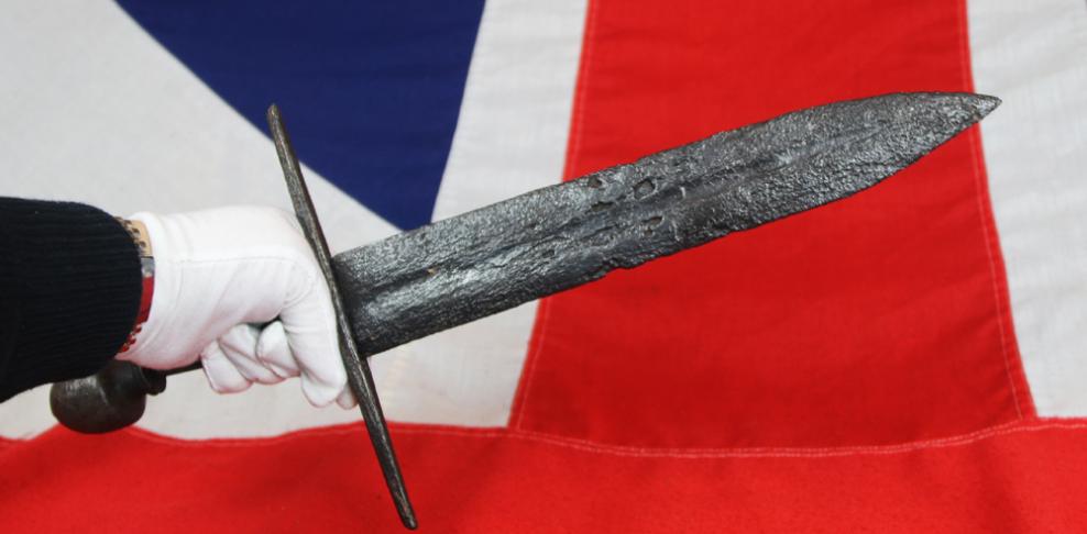 A Superb Original 12th Century Crusader Knights Templar Medieval Knight's Dagger, A Shortened Knightly Sword, with Crucifix Hilt. The Blade Bears The Remains of a Templar Cross, Inlaid, in Gold Alloy Latten, Upon One Blade Face Below The Hilt