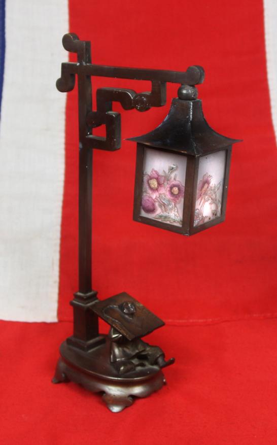 A Most Incredible and Intriguing European Art Deco Bronze Table Lamp, Decorated With the Subject of a Prisoner in an Ancient Chinese 'Cangue' Torture Device Beneath a Lamp