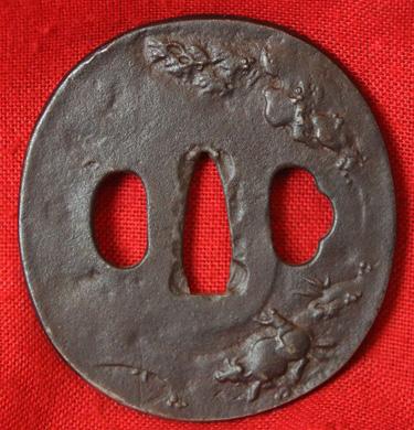 A Nice Edo Period Round Iron Plate Tsuba Decorated with A Boy Riding a Water Buffalo