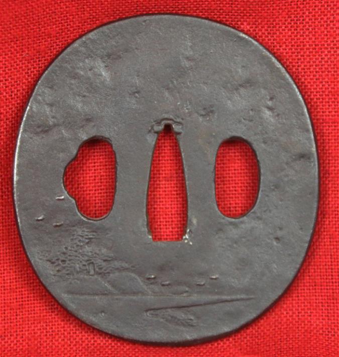 A Nice Edo Period Round Iron Plate Tsuba Decorated with A Boy Riding a Water Buffalo