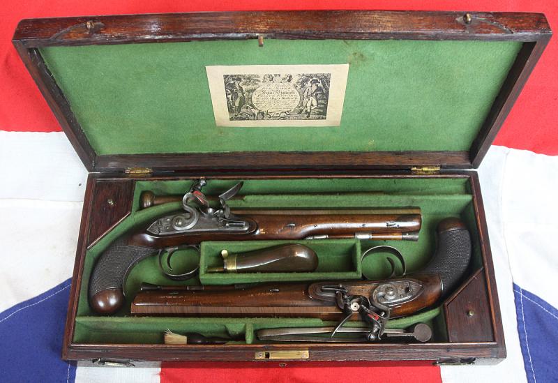 A Very Fine Condition Classic, Cased Pair of Late 18th to Early 19th Century Damascus Barrelled Duelling Pistols by Master Gunsmith William Parker of Holborn London. Original Oak Case with Tools and Accessories