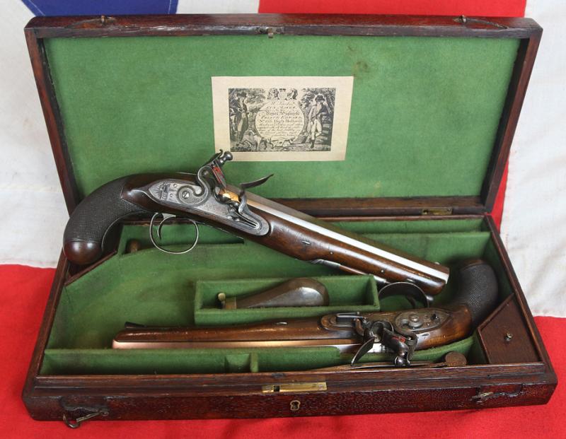 A Very Fine Condition Classic, Cased Pair of Late 18th to Early 19th Century Damascus Barrelled Duelling Pistols by Master Gunsmith William Parker of Holborn London. Original Oak Case with Tools and Accessories