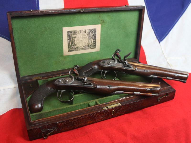 A Very Fine Condition Classic, Cased Pair of Late 18th to Early 19th Century Damascus Barrelled Duelling Pistols by Master Gunsmith William Parker of Holborn London. Original Oak Case with Tools and Accessories