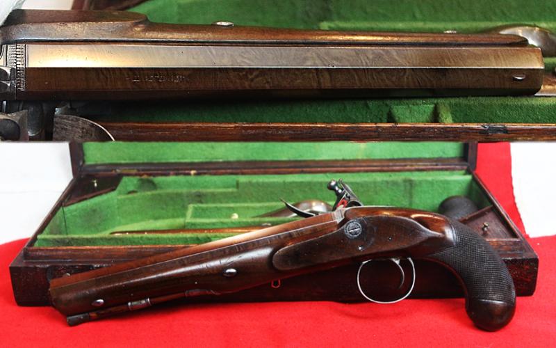 A Very Fine Condition Classic, Cased Pair of Late 18th to Early 19th Century Damascus Barrelled Duelling Pistols by Master Gunsmith William Parker of Holborn London. Original Oak Case with Tools and Accessories