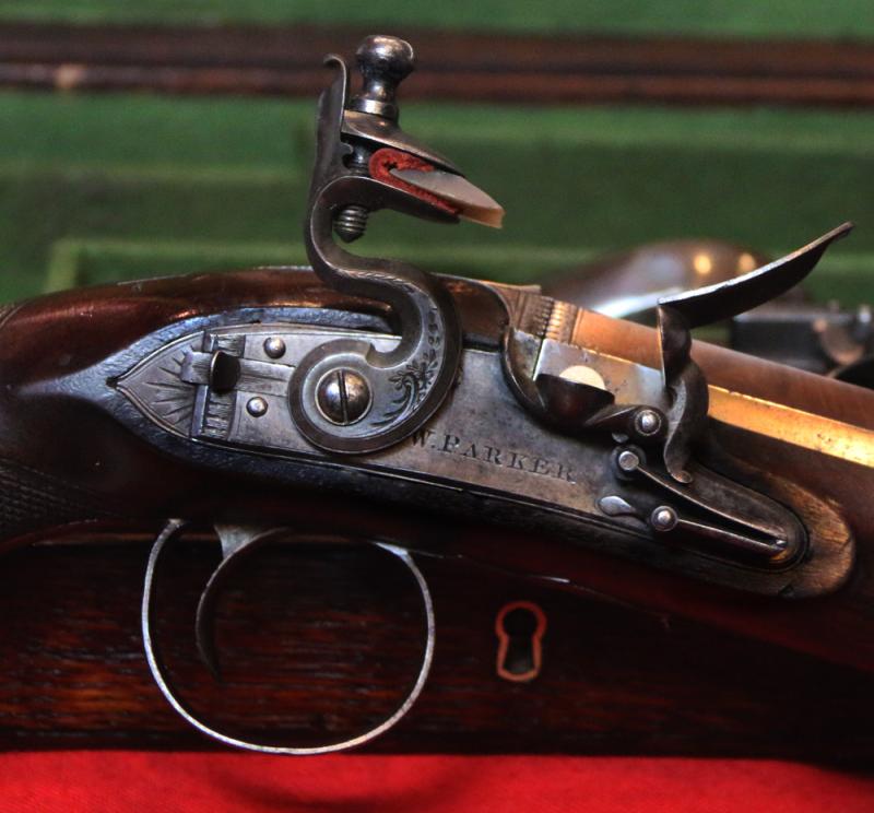 A Very Fine Condition Classic, Cased Pair of Late 18th to Early 19th Century Damascus Barrelled Duelling Pistols by Master Gunsmith William Parker of Holborn London. Original Oak Case with Tools and Accessories