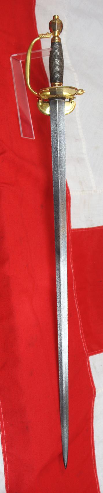 A Simply Stunning Most Rare Napoleonic Wars Type of a 1796 Infantry Officer's Sword, Monogrammed With Its Owner's Title and Monogram, Plus His Patriotic Motto “The Love Of, My Country, & Freedom” Etched Upon The Acutely Tapering “Needle Point’ Blade.