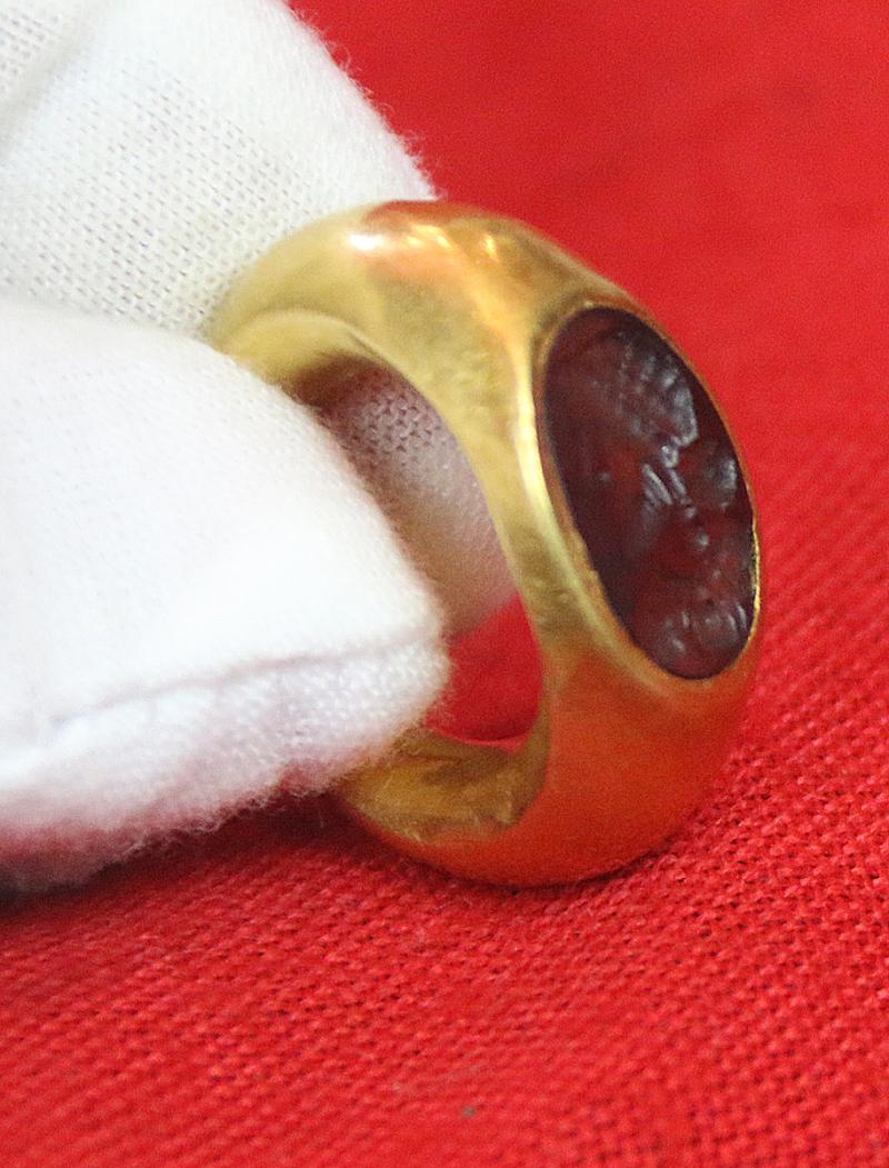 A Simply Stunning Ancient Roman Museum Grade Fine Gold Seal Ring with Intaglio Portrait Engraved Garnet Gem Stone 2nd to 3rd Century A.D. Likely a Depiction of an Emperor Such As Hadrian, Marcus Aurelius, Lucius Verus, or Even A Parthian Vassal King.