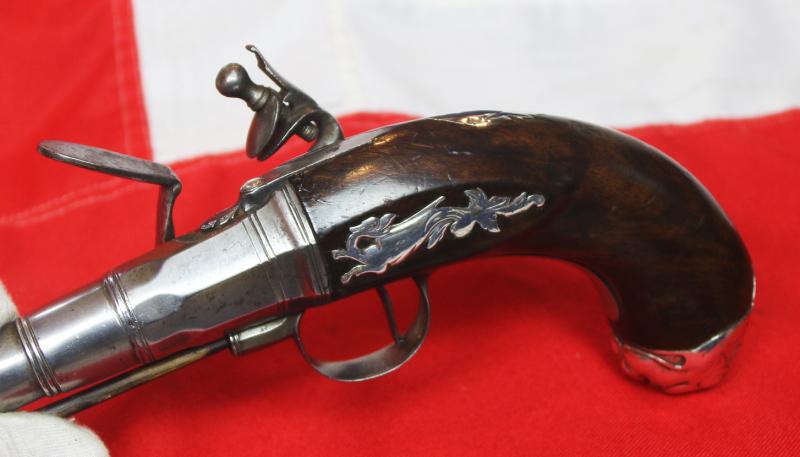 A Sublime 'Queen Anne', Circa 1720, Cannon Barrel Flintlock Holster Pistol of Sidelock Action, With Solid Silver Mounts Including a Silver, Maned Lion Head Butt Cap, and Silver Dragon Sideplate