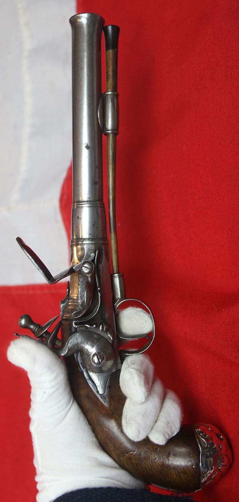 A Sublime 'Queen Anne', Circa 1720, Cannon Barrel Flintlock Holster Pistol of Sidelock Action, With Solid Silver Mounts Including a Silver, Maned Lion Head Butt Cap, and Silver Dragon Sideplate