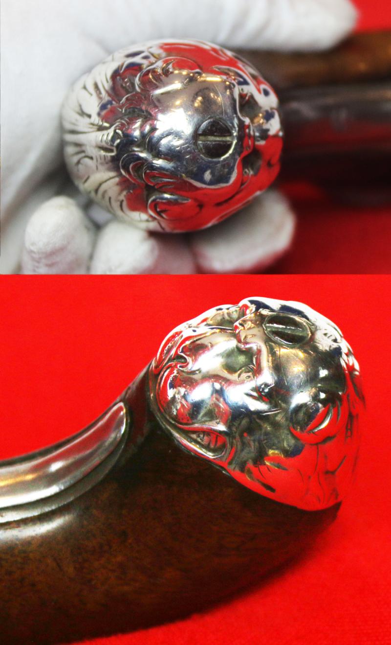 A Sublime 'Queen Anne', Circa 1720, Cannon Barrel Flintlock Holster Pistol of Sidelock Action, With Solid Silver Mounts Including a Silver, Maned Lion Head Butt Cap, and Silver Dragon Sideplate