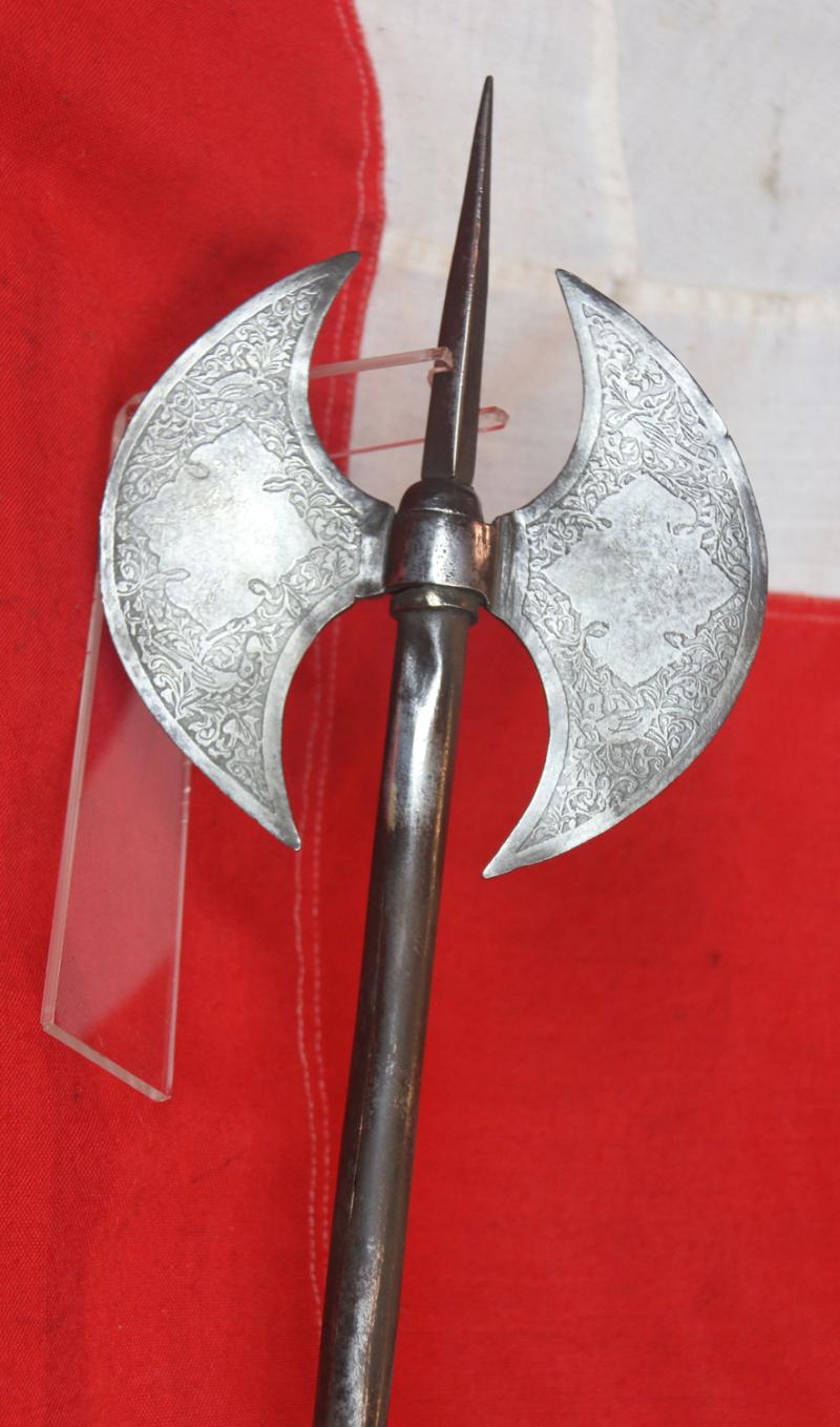 A 18th to Mid 19th Century Steel, Indo Persian, Double Crescent Blade Headed War Axe and Spike, Known as a Tabarzin