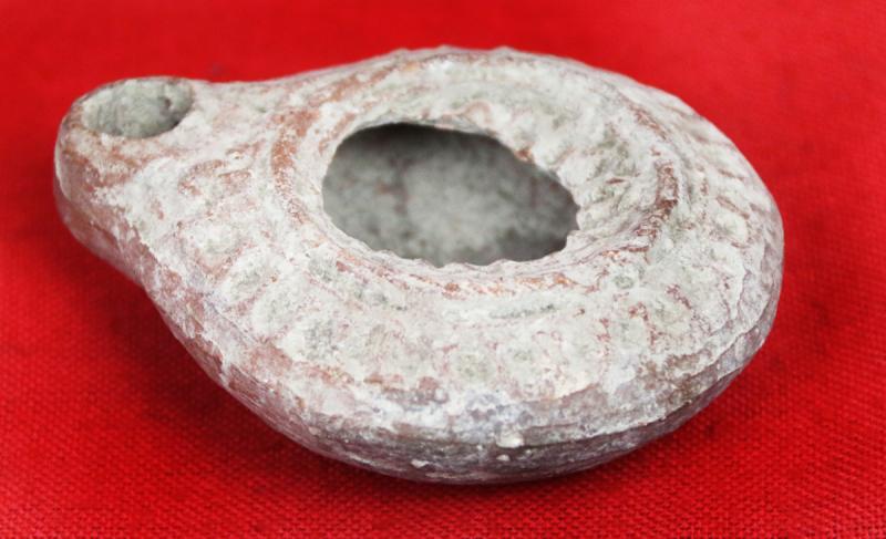 Ancient Imperial Roman Discus Form Oil Lamp with Embossed Design Circa 100 AD