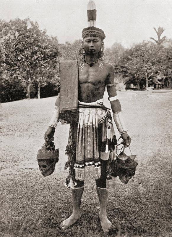 A Dyak Of Borneo, Tribesman's Mandau. A Tribal Head Hunter's Sword, From Kalimantan Island