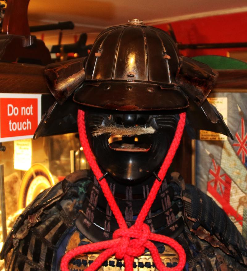 A Beautiful Suit of Edo Samurai Armour in Gold and Black Lacquer With Blue and Black Lacing, Multi Plate Helmet with Dragon Fly Fukegaeshi, With Ressai {Fierce Face} Menpo