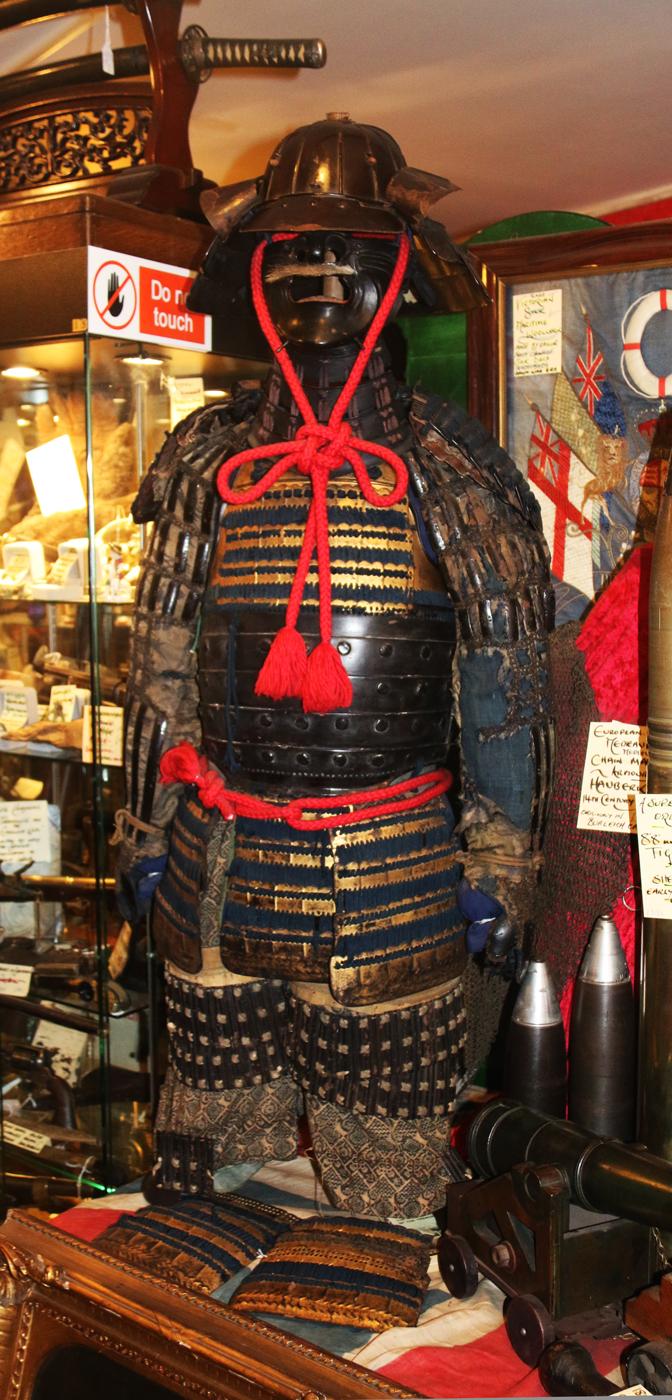 A Beautiful Suit of Edo Samurai Armour in Gold and Black Lacquer With Blue and Black Lacing, Multi Plate Helmet with Dragon Fly Fukegaeshi, With Ressai {Fierce Face} Menpo