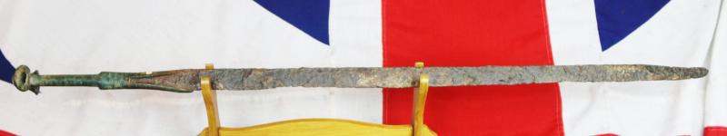 A Wonderful, Museum Piece. A Rare, Ancient Bronze and Iron Incredibly Long, High Status, Combat Cavalry Sword. 36 Inches Long. A Finely Engraved 'Eared' Bronze Hilt With a Long Iron Back Sword Blade. Around 3200 Years Old