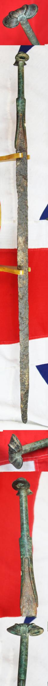 A Wonderful, Museum Piece. A Rare, Ancient Bronze and Iron Incredibly Long, High Status, Combat Cavalry Sword. 36 Inches Long. A Finely Engraved 'Eared' Bronze Hilt With a Long Iron Back Sword Blade. Around 3200 Years Old