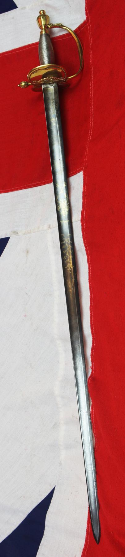 A Very Good 1796 Pattern Infantry Officer's Sword, Beautiful Gilt and Solid Silver Grip. Stunningly Hand Engraved with Royal Crest, Crowned Cyphers And A Standing Infantry Officer Holding His 1796 infantry Sword.