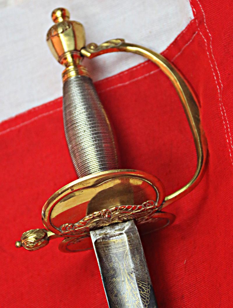 A Very Good 1796 Pattern Infantry Officer's Sword, Beautiful Gilt and Solid Silver Grip. Stunningly Hand Engraved with Royal Crest, Crowned Cyphers And A Standing Infantry Officer Holding His 1796 infantry Sword.