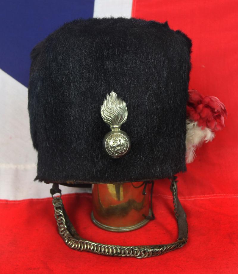 Scarce Antique Victorian Regimental Racoon Skin Cap of The Northumberland Fusiler's. Flaming Fusiler Grenade Badge With George and The Dragon Regimental Motto Quo Fata Vocant With Red and White Feather Hackle, and Curb Chin Chain