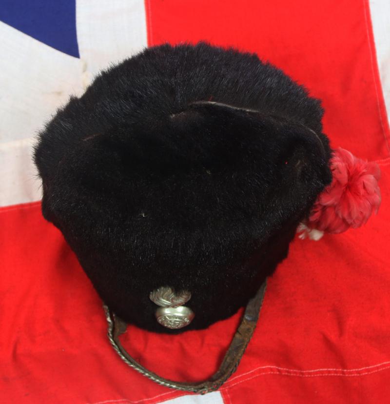 Scarce Antique Victorian Regimental Racoon Skin Cap of The Northumberland Fusiler's. Flaming Fusiler Grenade Badge With George and The Dragon Regimental Motto Quo Fata Vocant With Red and White Feather Hackle, and Curb Chin Chain