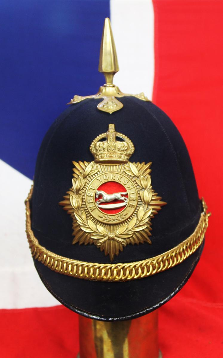 A Superb British, Original, Regimental Edwardian Service Helmet. of The West Yorkshire Regiment. Blue Cloth with Gold Badge, Fittings, Spike, & Rose Head Curb Chain Mounts and Chin Chain