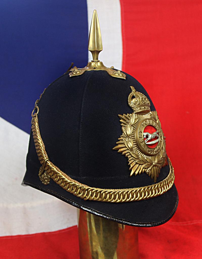 A Superb British, Original, Regimental Edwardian Service Helmet. of The West Yorkshire Regiment. Blue Cloth with Gold Badge, Fittings, Spike, & Rose Head Curb Chain Mounts and Chin Chain