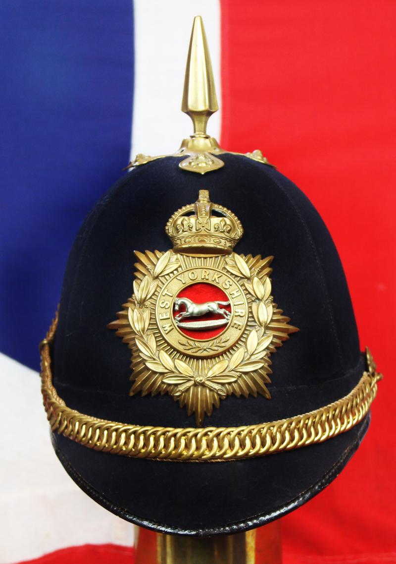 A Superb British, Original, Regimental Edwardian Service Helmet. of The West Yorkshire Regiment. Blue Cloth with Gold Badge, Fittings, Spike, & Rose Head Curb Chain Mounts and Chin Chain