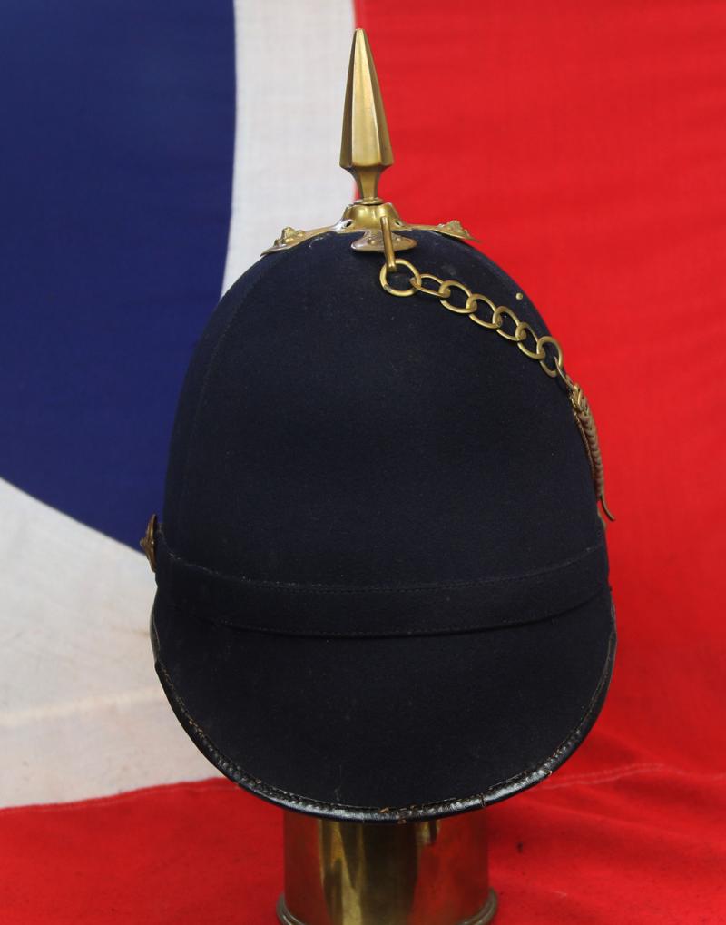 A Superb British, Original, Regimental Edwardian Service Helmet. of The West Yorkshire Regiment. Blue Cloth with Gold Badge, Fittings, Spike, & Rose Head Curb Chain Mounts and Chin Chain