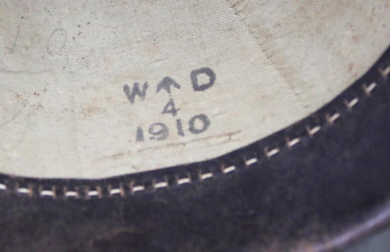 A Superb Antique Edwardian Service Helmet of The Dorsetshire Regiment. Blue Cloth with Gold Badge, Fittings, Spike, & Rose Head Curb Chain Mounts and Chin Chain