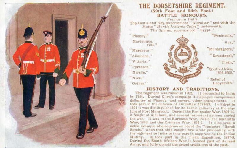 A Superb Antique Edwardian Service Helmet of The Dorsetshire Regiment. Blue Cloth with Gold Badge, Fittings, Spike, & Rose Head Curb Chain Mounts and Chin Chain