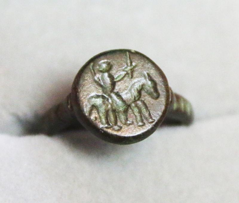 A Fabulous Knight’s Seal Ring, From Agincourt to the Wars of the Roses Period. A 15th Century Ring with an Intaglio Stylized Engraving of An Armoured Knight on Horseback Holding Aloft His Knightly Sword, a Fabulous and Beautiful Piece.