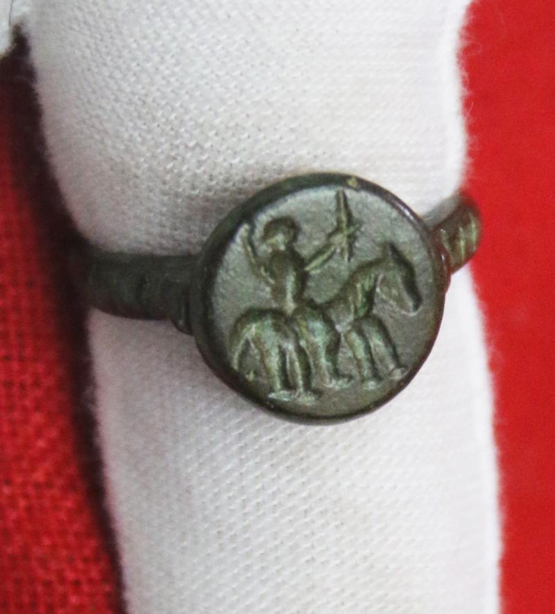 A Fabulous Knight’s Seal Ring, From Agincourt to the Wars of the Roses Period. A 15th Century Ring with an Intaglio Stylized Engraving of An Armoured Knight on Horseback Holding Aloft His Knightly Sword, a Fabulous and Beautiful Piece.