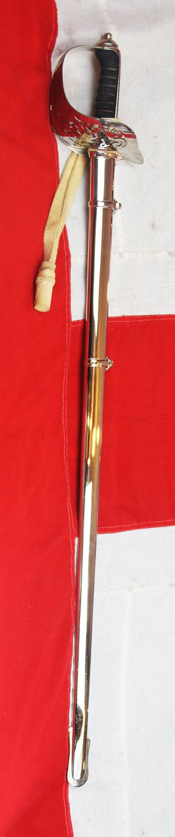 A Very Good Current Service 1897 Pattern ERII Post 1953 Officer's Sword In Nickel Plated Dress Scabbard, with Its Original Buff Hide Knot