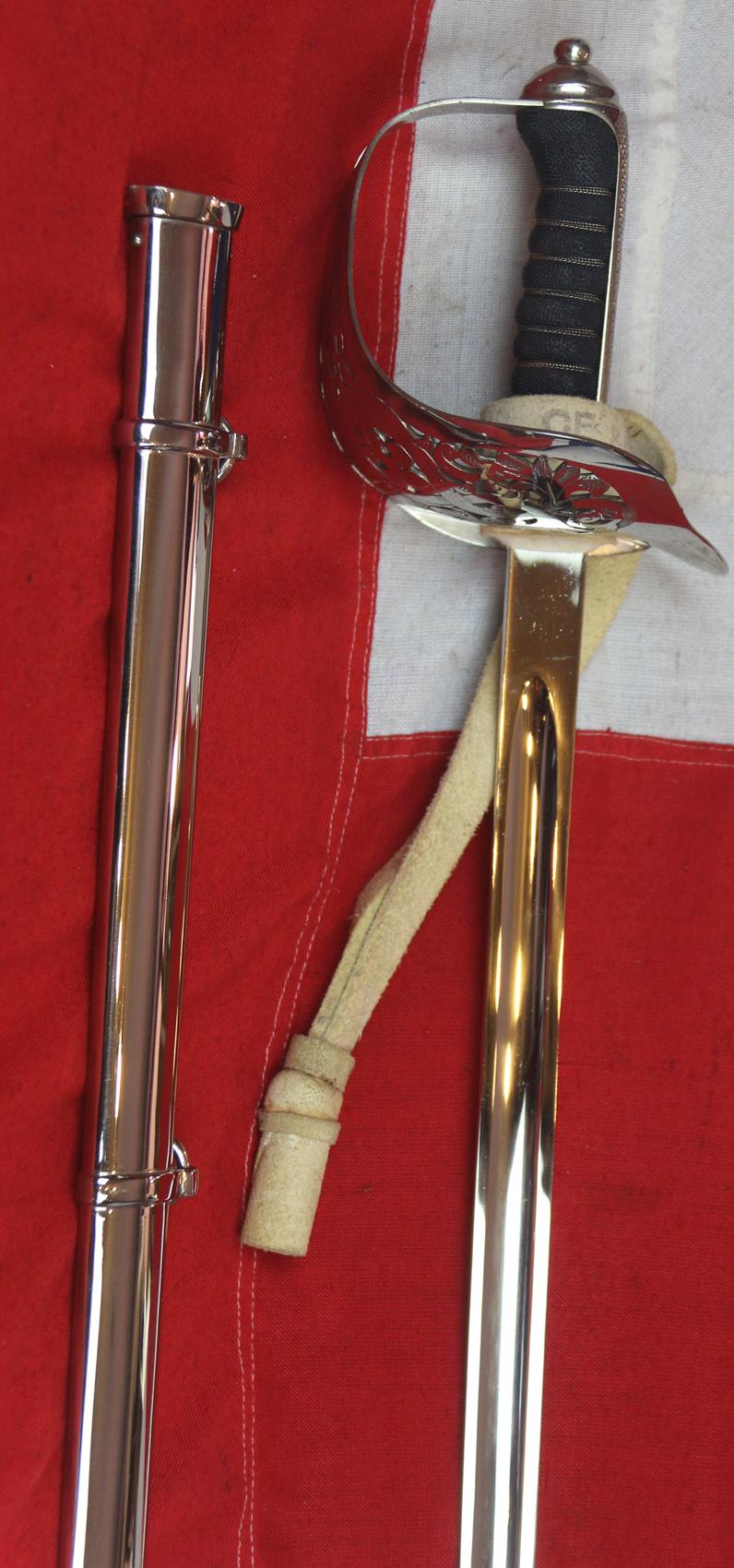 A Very Good Current Service 1897 Pattern ERII Post 1953 Officer's Sword In Nickel Plated Dress Scabbard, with Its Original Buff Hide Knot