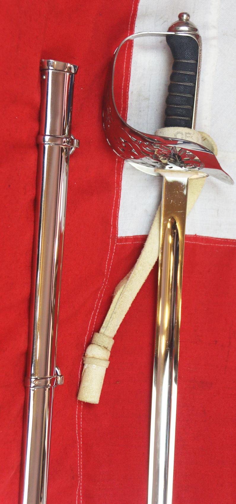 A Very Good Current Service 1897 Pattern ERII Post 1953 Officer's Sword In Nickel Plated Dress Scabbard, with Its Original Buff Hide Knot