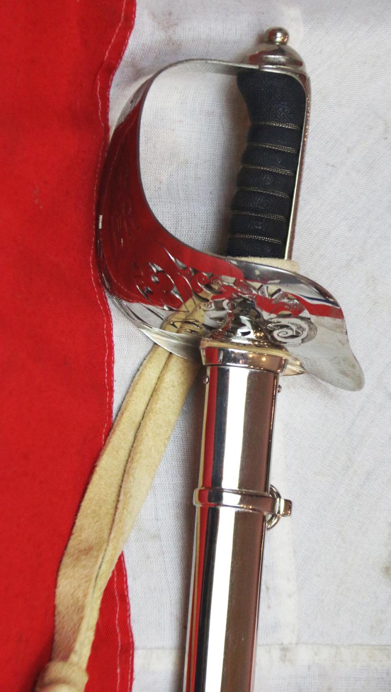 A Very Good Current Service 1897 Pattern ERII Post 1953 Officer's Sword In Nickel Plated Dress Scabbard, with Its Original Buff Hide Knot